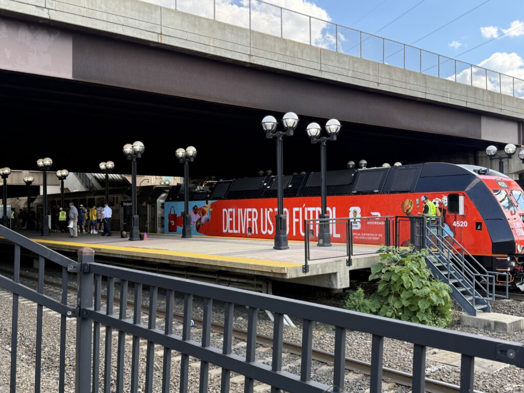 Red train at the Secaucus Junction platform.